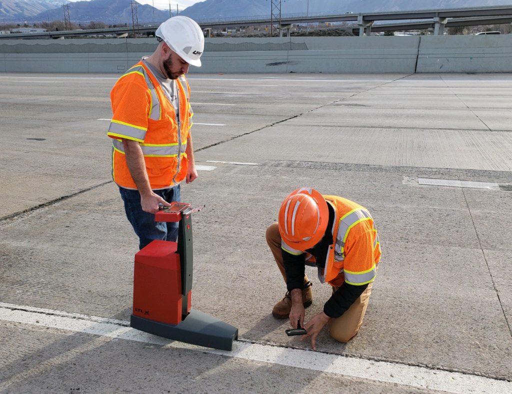 Photo Engineers measure retroreflectivity of striping using a reflectometer